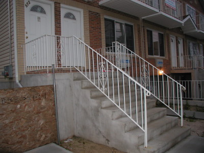 Steel welded economy stair railings with ½" solid pickets and handrail molding on top. (Bronx, NY)