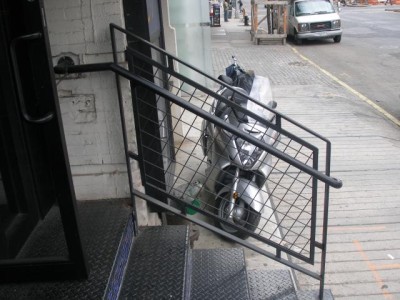 Steel welded wire mesh guard rail with hand rail. (Manhattan, NY)
