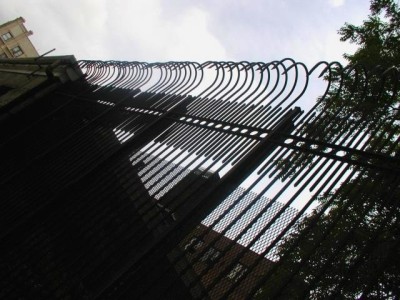 Solid steel bar 8' defender fence. Mounted on 3"x ¼" tube steel posts with caps.(Brooklyn, NY) 1of 2
