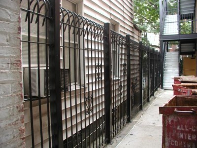 Solid steel bar 8' defender fence. Mounted on 3"x ¼" tube steel posts with caps.(Brooklyn, NY) 2 of 2