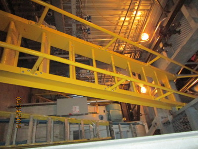 Boiler room catwalks and fixed ship ladders constructed of structural steel channel, galvanized grating all shop welded prepped for fully bolted assembly onsite. Painted safety yellow,welded pipe railings are attached by bolting to stringer channel.
