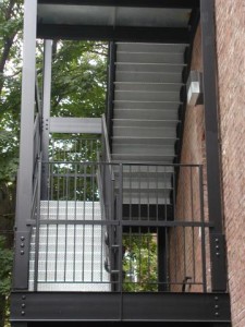 Galvanized diamond plate steel staircase with landings, railings, and handrails. Painted structure. (Bronx, NY)