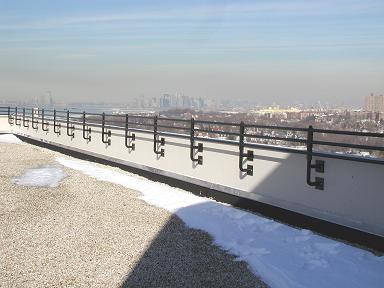 Parapet welded pipe railing. Powder coated and plate / bolted – Multi unit residential (Queens NY)