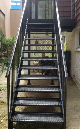 exterior metal stairs with open tread diamond plate fully welded steel steps and solid railings. (1)