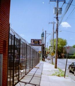 Expanded metal mesh welded steel fence with motorized roll down coiling gate with barded wire and razor ribbon for parking lot. (Brooklyn, NY) 2 of 2
