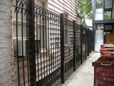 Solid steel bar 8′ defender fence. Mounted on 3″x ¼” tube steel posts with caps.(Brooklyn, NY) 2 of 2