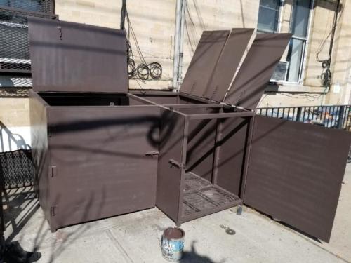 Outdoor garbage pail steel enclosure steel mesh lockable slidebolts lifting handles