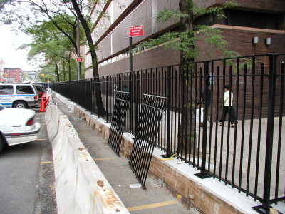 Solid steel 4′ fence, curb mounted/ welded base plates. (NY, NY)