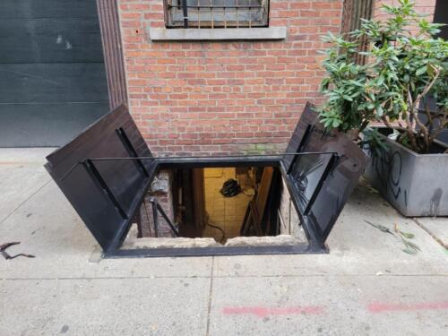 Cellar door secure sidewalk nyc